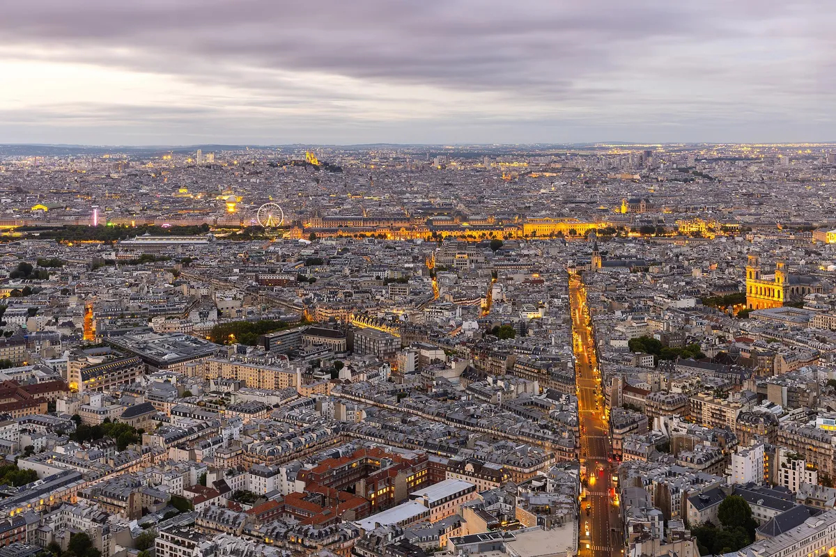Panoramic view on the illuminated Rue de Rennes and Notre-Dame de Paris at sunset France