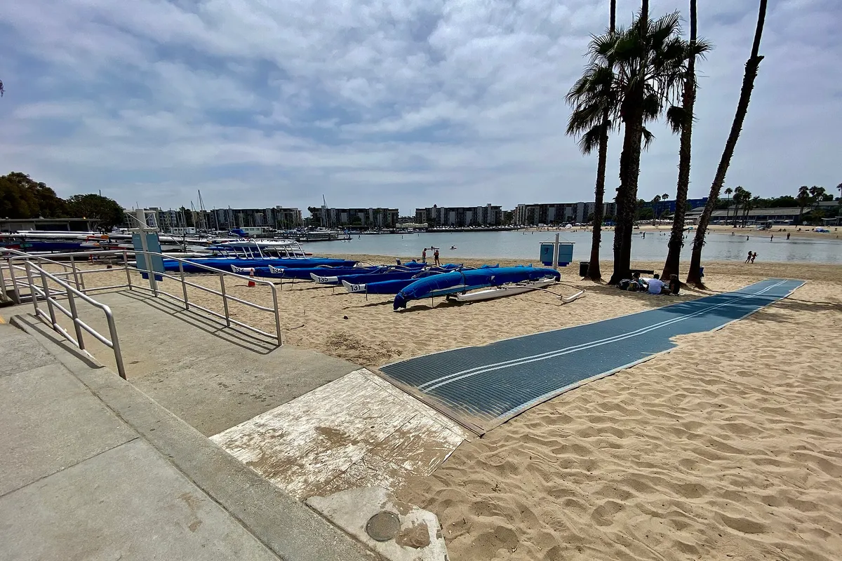 Beach accessibility mobi-mat and wheelchair ramp