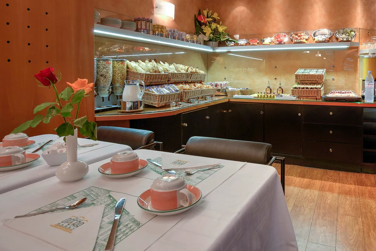 Breakfast buffet and table - Paris Opera Cadet Hotel