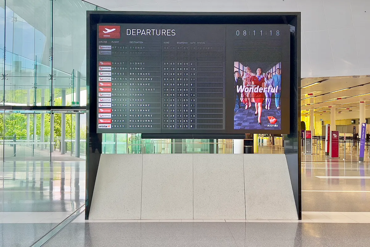 Flight departure board at Canberra Airport, November 2022